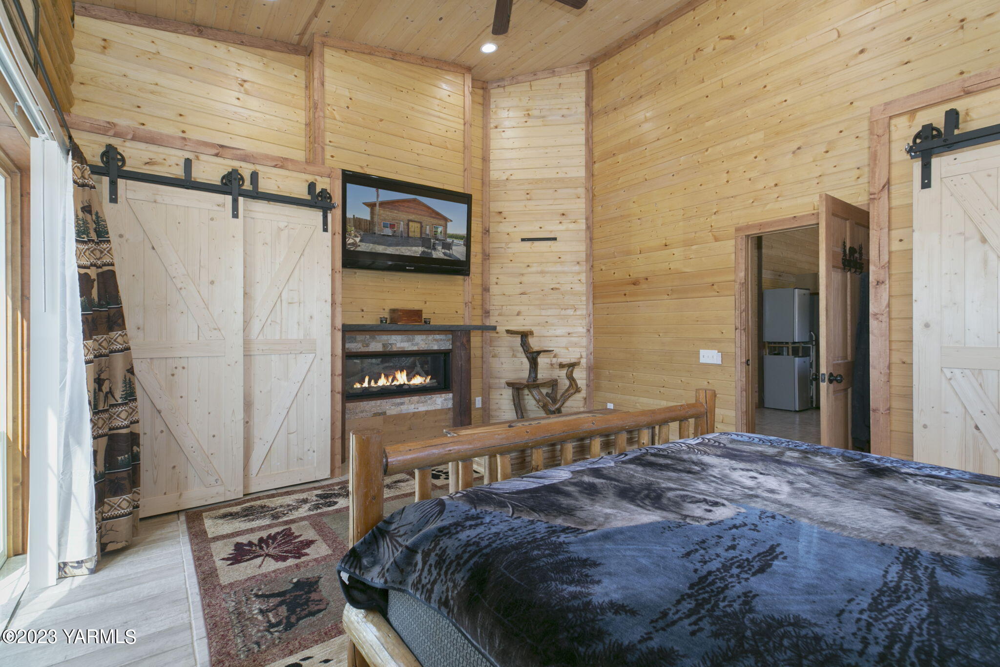 641 Walters Road Moxee, WA 98936 - Photo 7 of 23 a bedroom with a bed a flat screen tv and cabinets