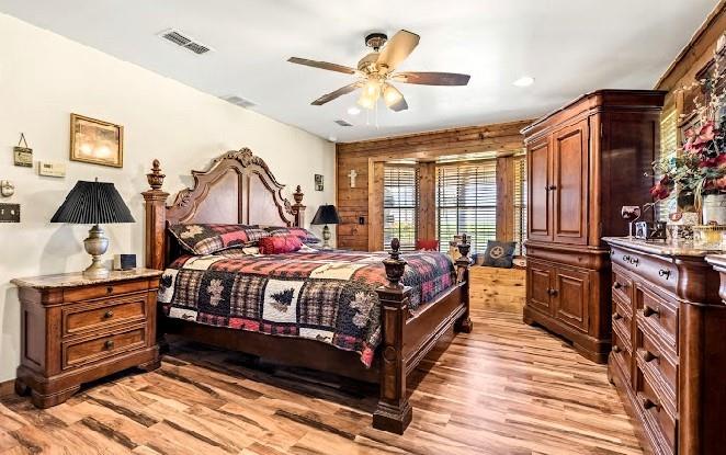 783 County Road 4420 Whitewright, TX 75491 - Photo 13 of 40 a bedroom with a bed and wooden floor