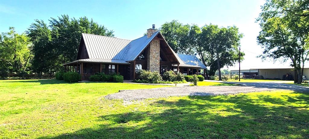 783 County Road 4420 Whitewright, TX 75491 - Photo 3 of 40 a view of a swimming pool with plants and small yard