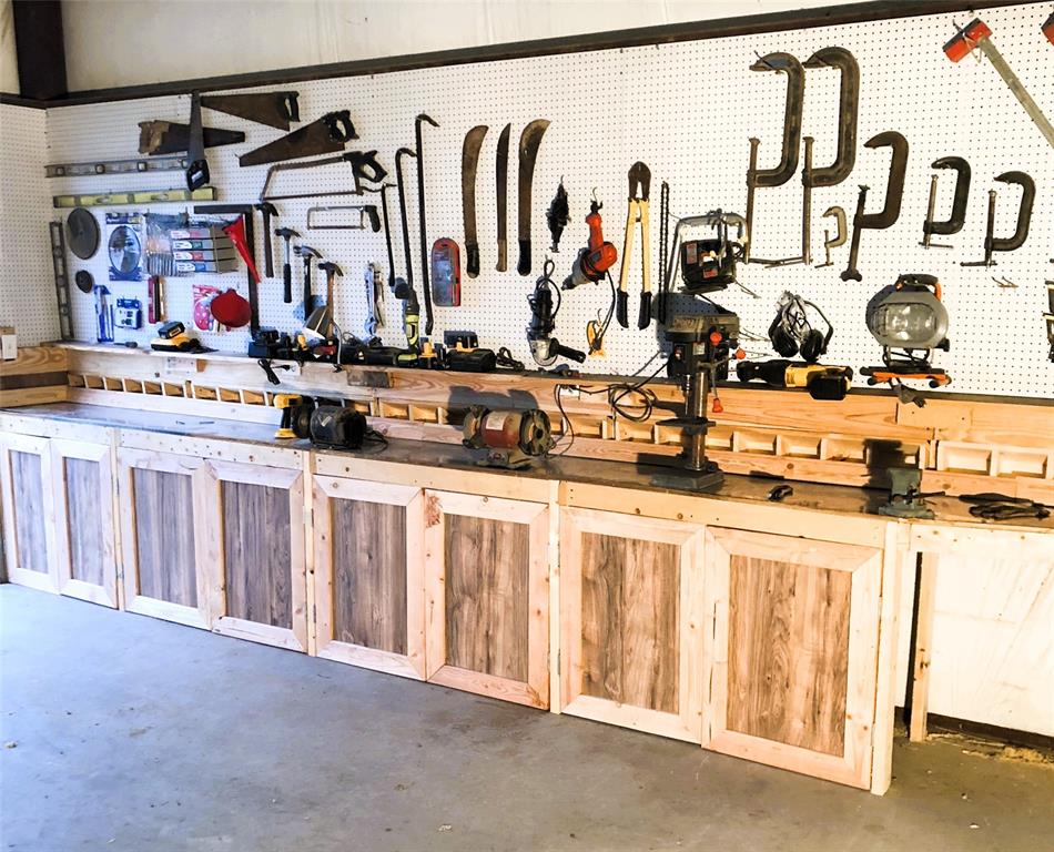 783 County Road 4420 Whitewright, TX 75491 - Photo 32 of 40 a view of walk in closet with clothes and shoes