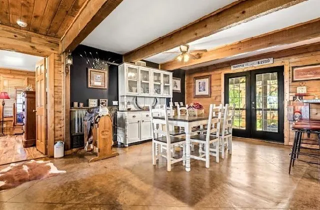 a view of a dining hall with furniture and floor to ceiling window