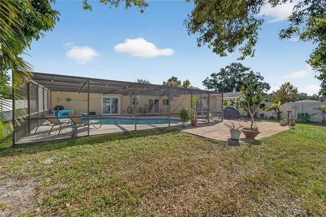 a view of a swimming pool with a patio