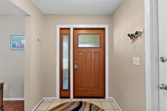 a view of front door with a chair