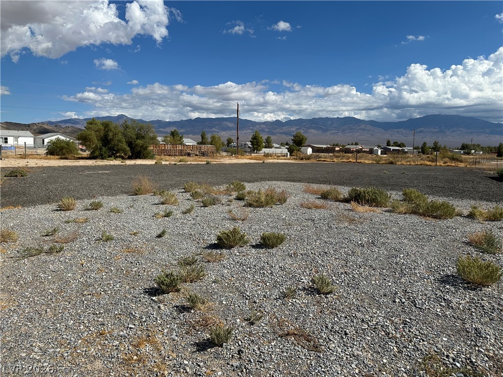 3270 West Simkins Road Pahrump, NV 89060 - Photo 8 of 36 Dramatic mountain vistas frame this vast desert lot offering incredible potential.