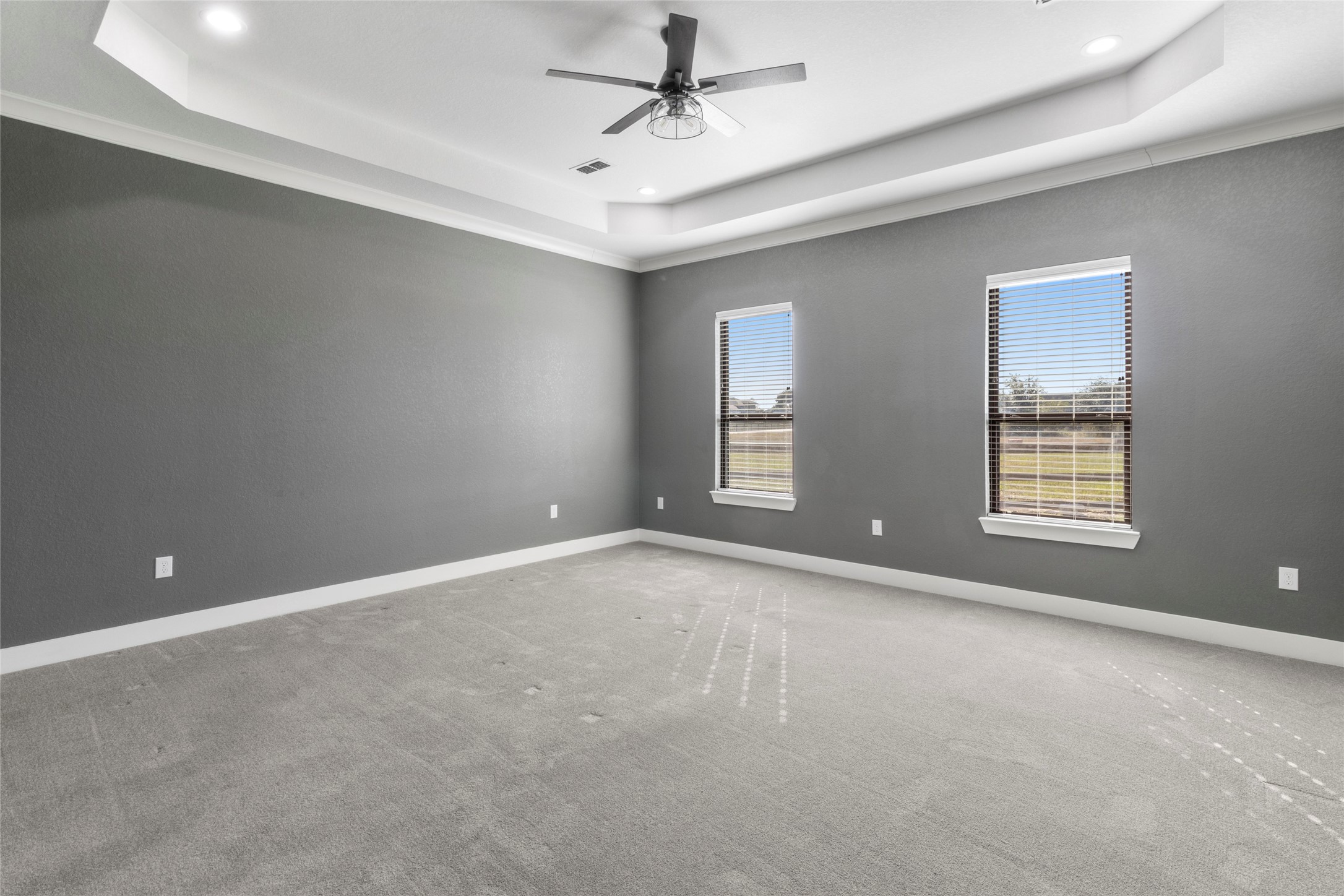 22010 Chenango Lake Drive Angleton, TX 77515 - Photo 15 of 43 an empty room with windows and ceiling fan