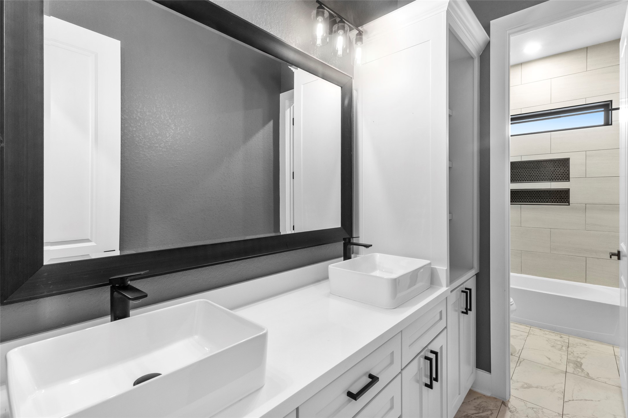 22010 Chenango Lake Drive Angleton, TX 77515 - Photo 25 of 43 a bathroom with a sink and a mirror