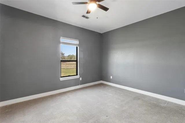 an empty room with a bathroom