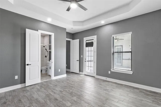 a white toilet sitting next to a bathroom sink