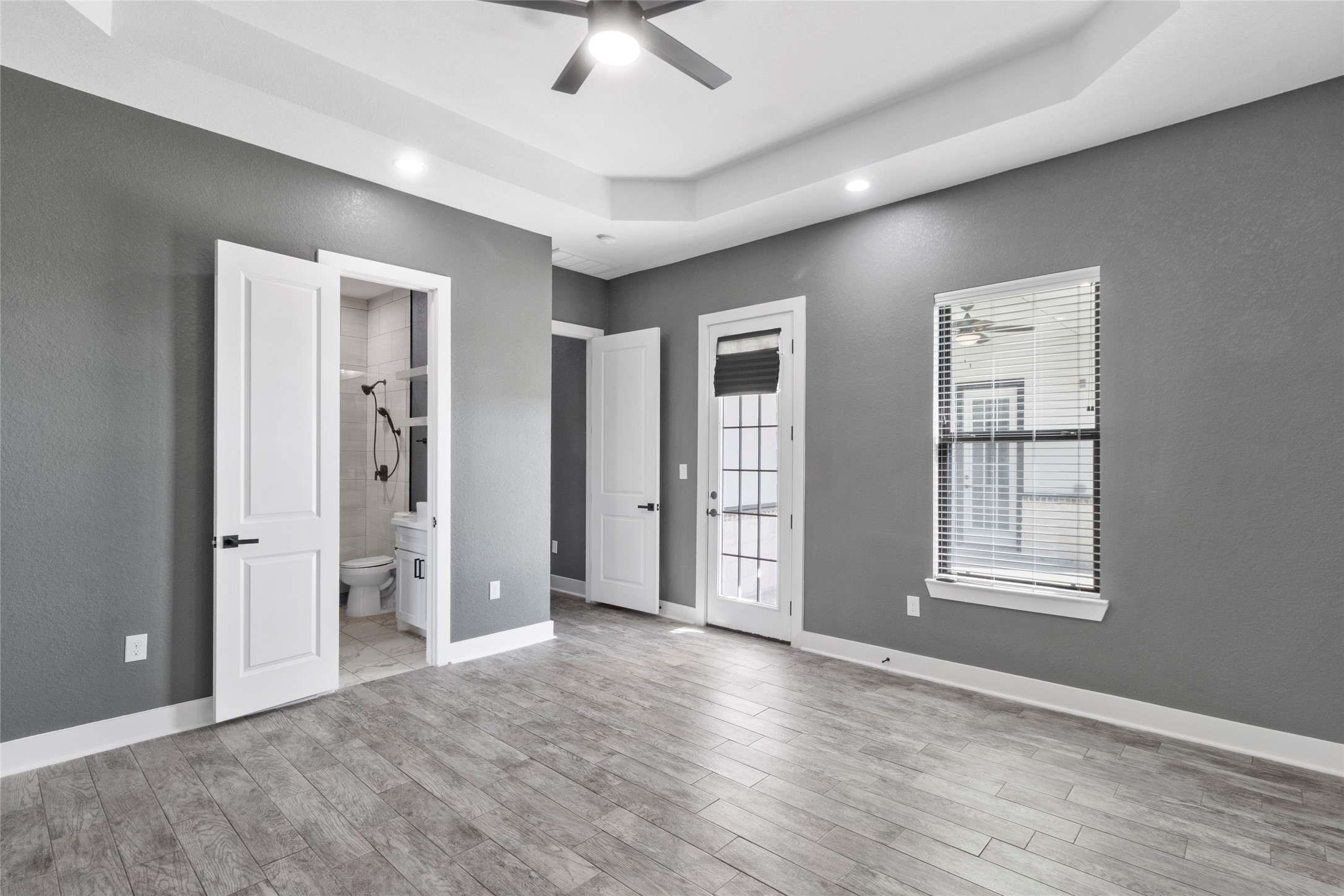 22010 Chenango Lake Drive Angleton, TX 77515 - Photo 29 of 43 a view of an empty room with window and wooden floor