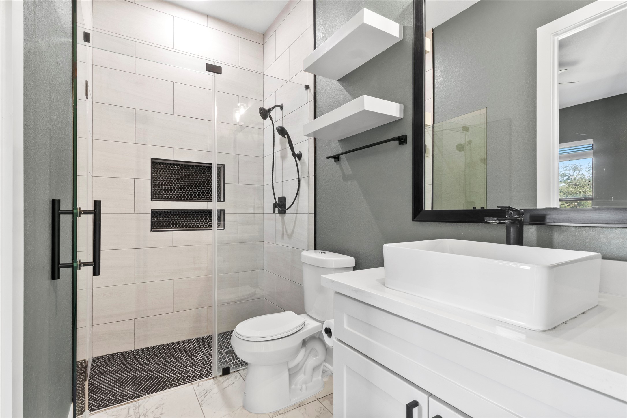 22010 Chenango Lake Drive Angleton, TX 77515 - Photo 30 of 43 a white toilet sitting next to a bathroom sink