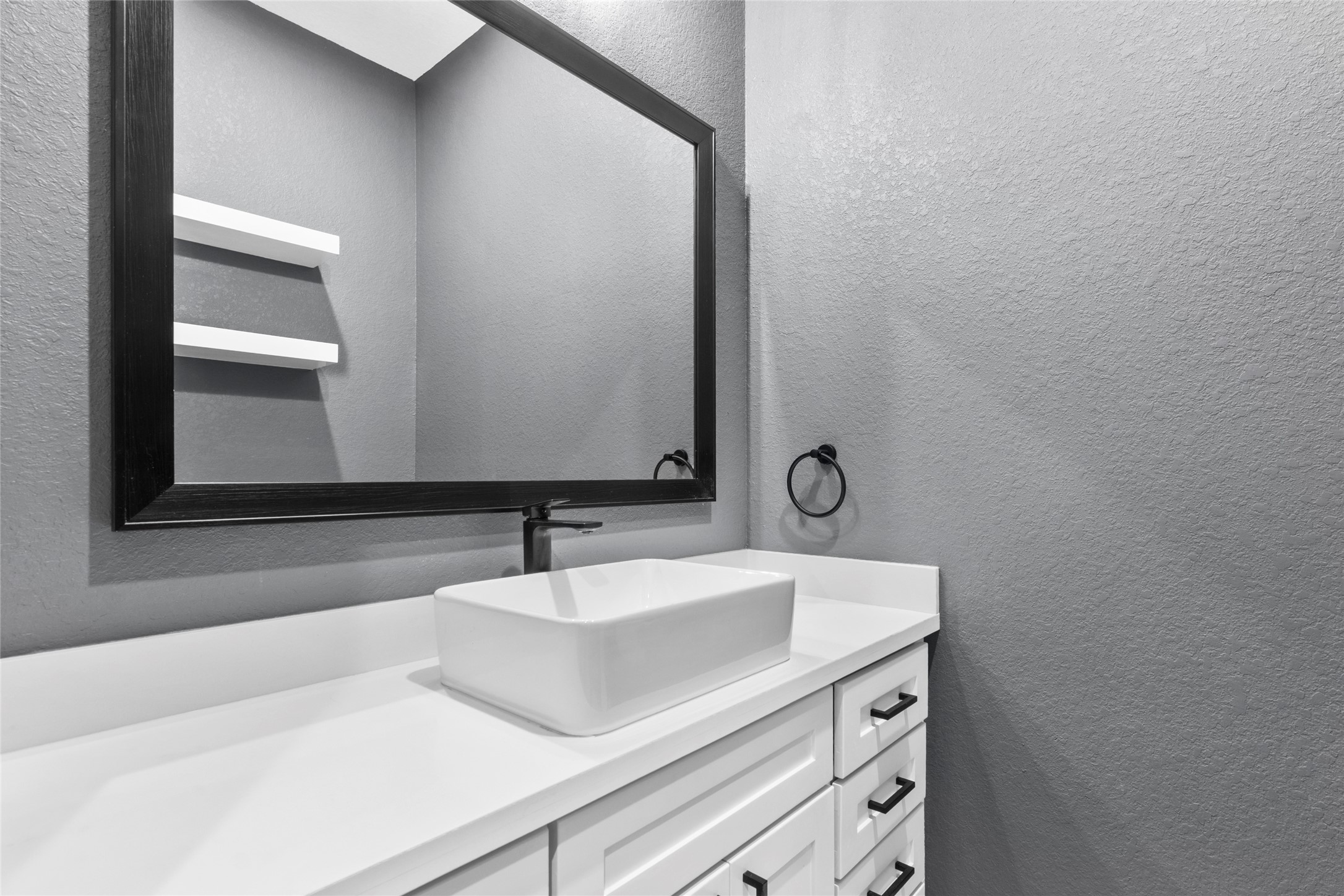 22010 Chenango Lake Drive Angleton, TX 77515 - Photo 35 of 43 a bathroom with a sink and a mirror