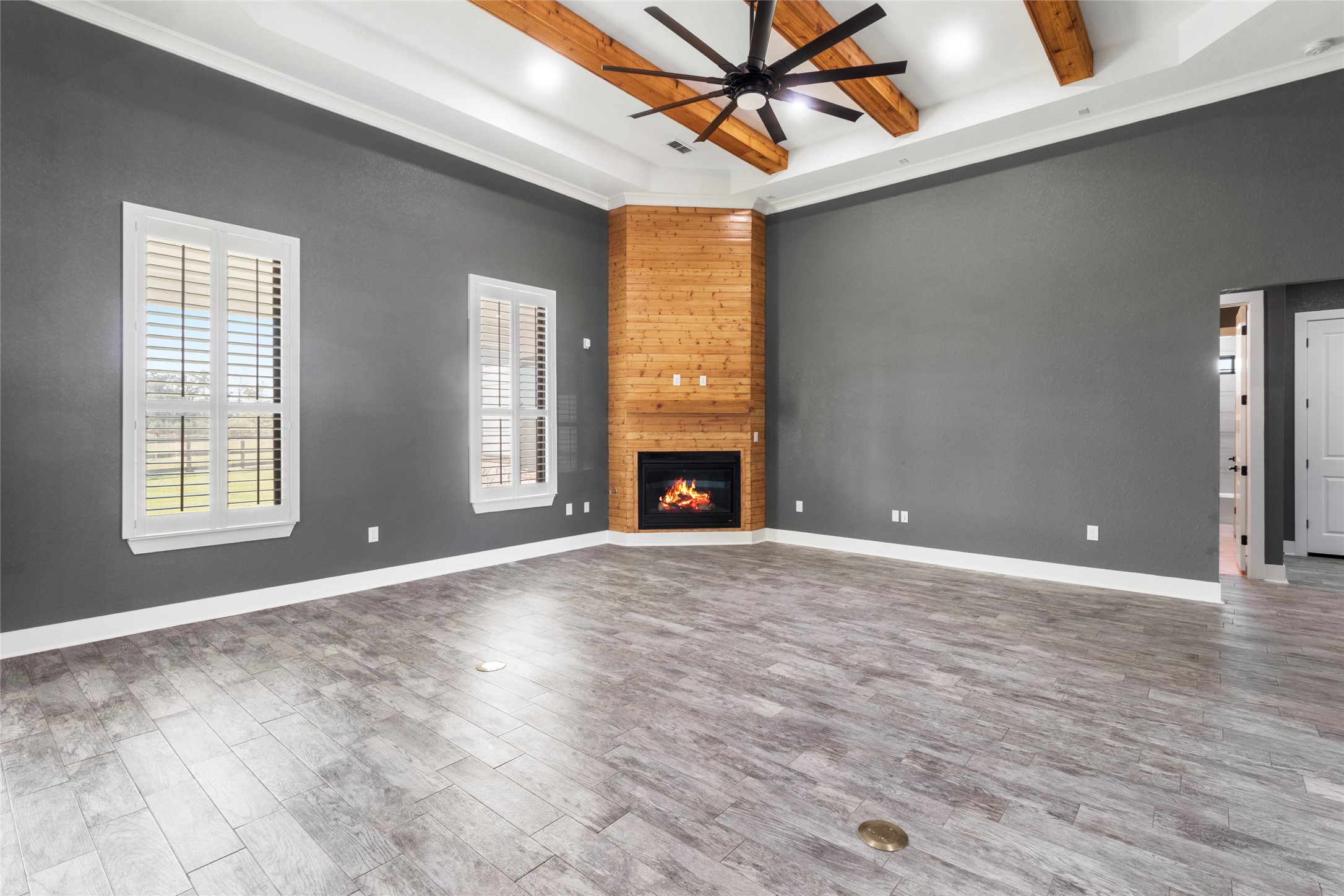 22010 Chenango Lake Drive Angleton, TX 77515 - Photo 6 of 43 a view of an empty room with a window and a fireplace