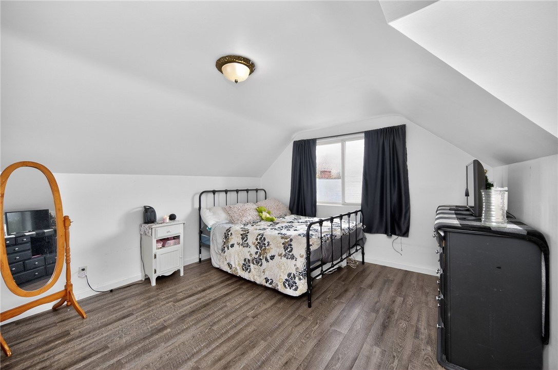 3301 Wildwood Road Middletown, OH 45042 - Photo 27 of 68 This cozy attic bedroom offers sloped ceilings and durable flooring.
