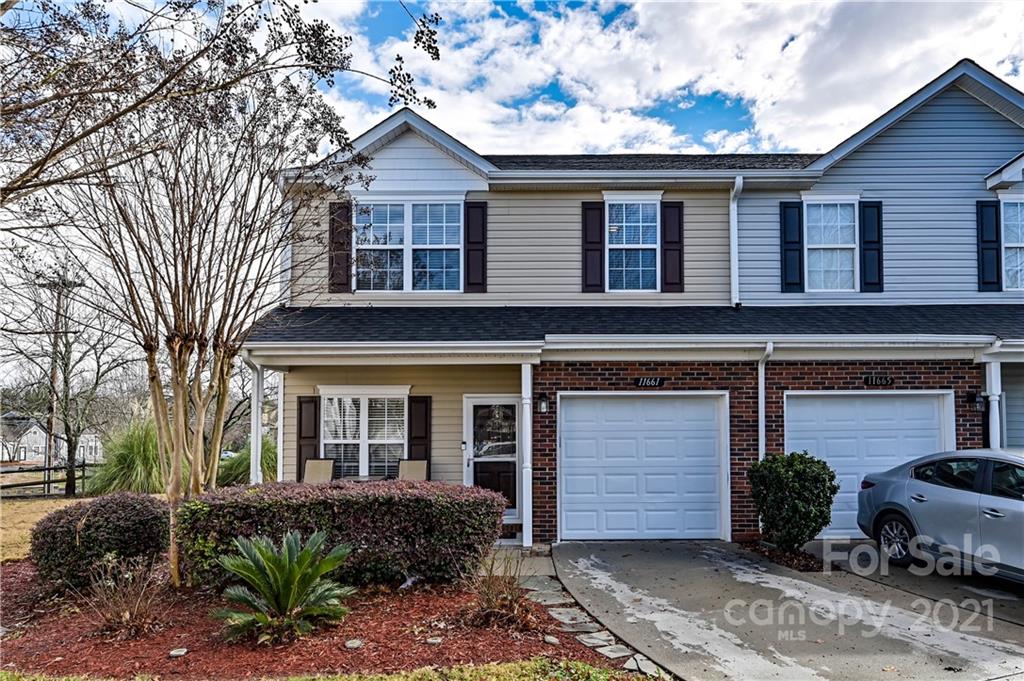 11661 Coddington Ridge Drive Charlotte, NC 28214 - Photo 1 of 23 a front view of a house with a yard