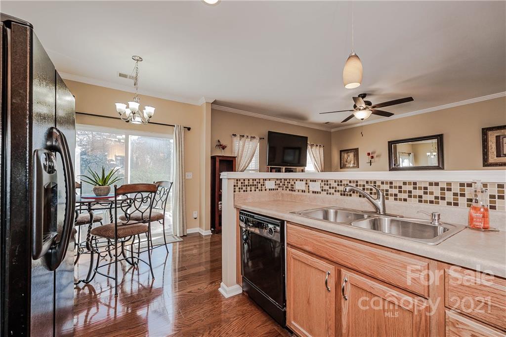 11661 Coddington Ridge Drive Charlotte, NC 28214 - Photo 11 of 23 a kitchen with stainless steel appliances granite countertop a sink and a refrigerator
