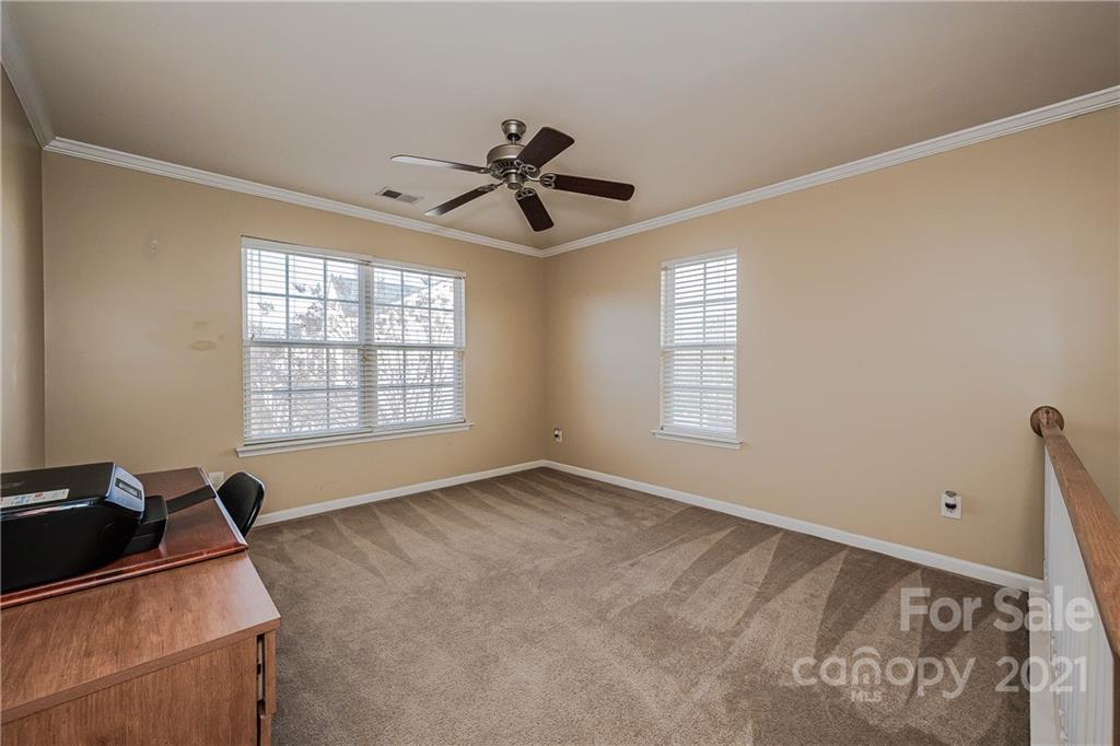 11661 Coddington Ridge Drive Charlotte, NC 28214 - Photo 13 of 23 a view of a room with windows and ceiling fan