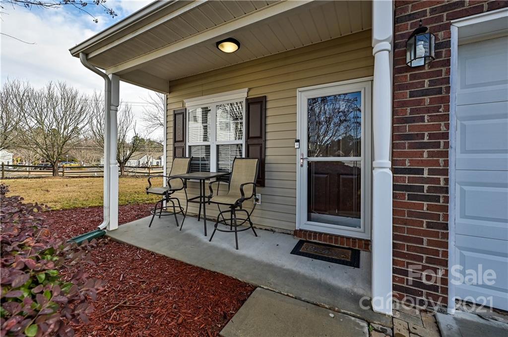 11661 Coddington Ridge Drive Charlotte, NC 28214 - Photo 4 of 23 a view of a porch with chairs and backyard