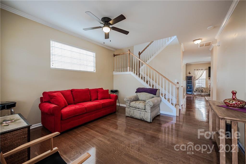 11661 Coddington Ridge Drive Charlotte, NC 28214 - Photo 5 of 23 a living room with furniture and a wooden floor