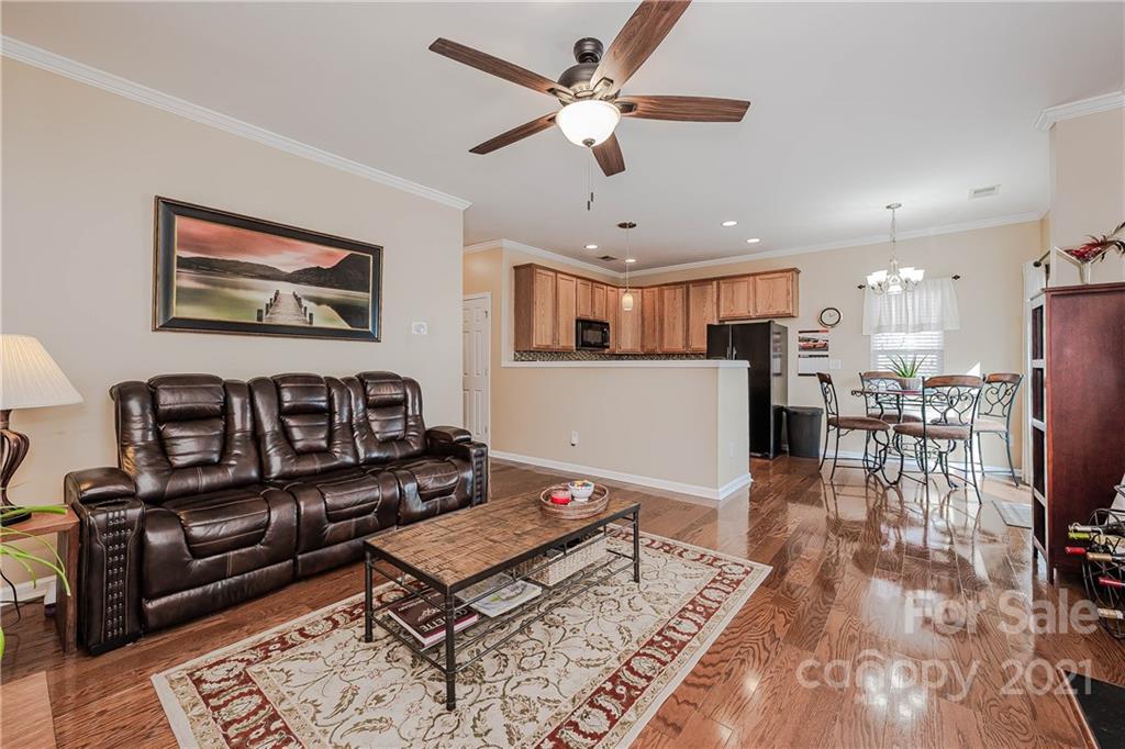 11661 Coddington Ridge Drive Charlotte, NC 28214 - Photo 6 of 23 a living room with furniture and kitchen view
