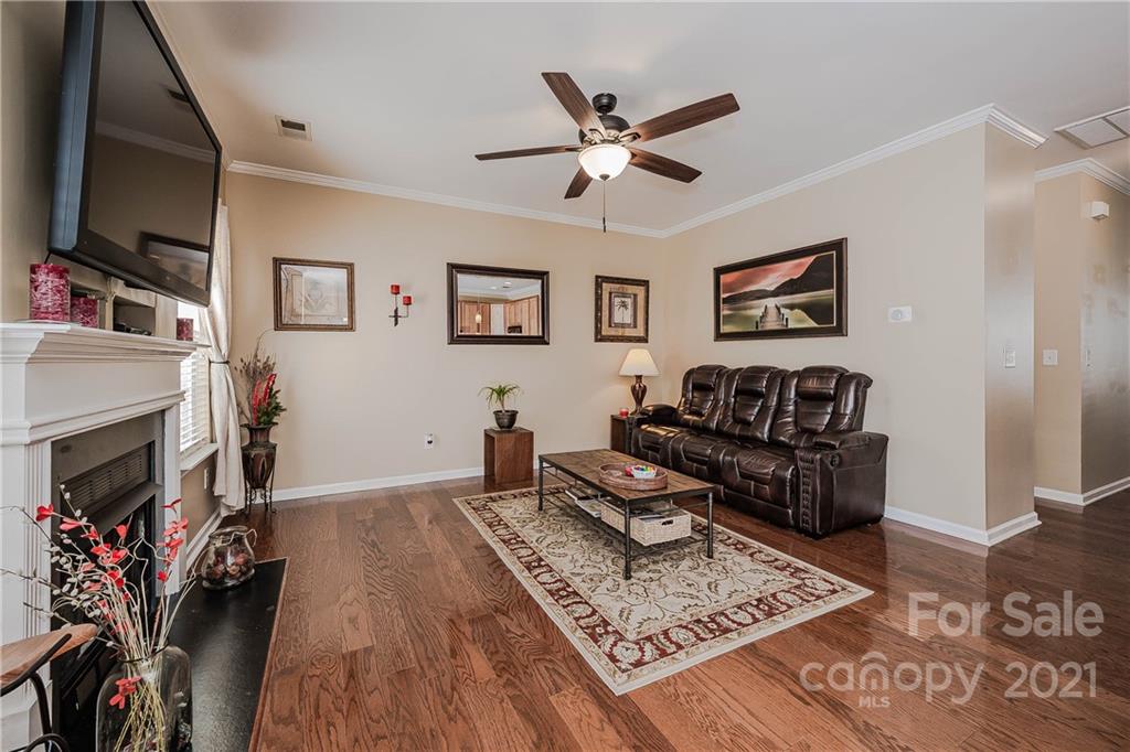 11661 Coddington Ridge Drive Charlotte, NC 28214 - Photo 8 of 23 a living room with furniture and a flat screen tv