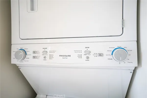 a view of white house with garden