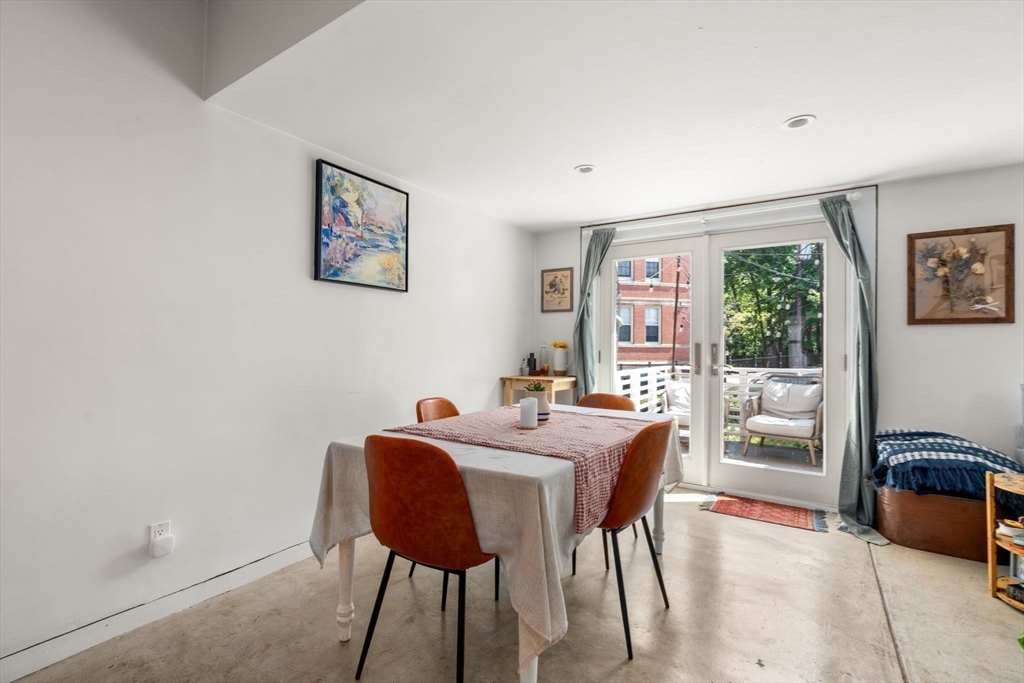 67 Dudley Street, Unit SF Boston, MA 02119 - Photo 11 of 28 a view of a dining room with furniture window and outside view