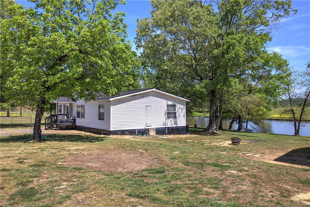 486 County Line Road Resaca, GA 30735 - Photo 20 of 49 a house view with a outdoor space