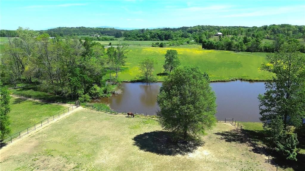 486 County Line Road Resaca, GA 30735 - Photo 42 of 49 a aerial view of a house with a yard and lake view