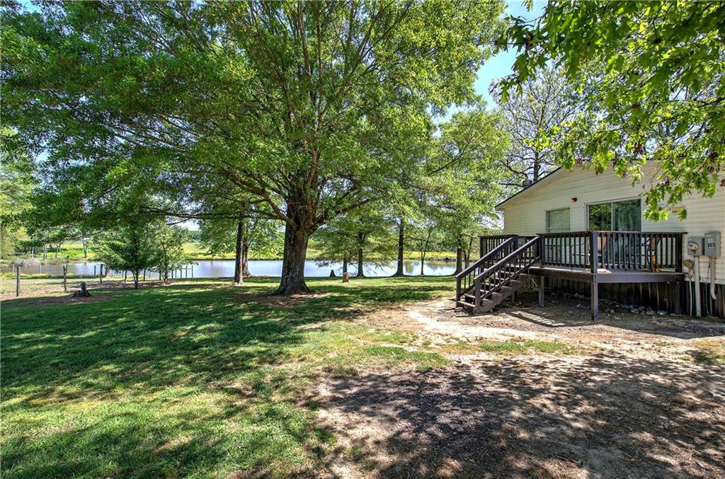 486 County Line Road Resaca, GA 30735 - Photo 6 of 49 a view of a house with backyard and a tree