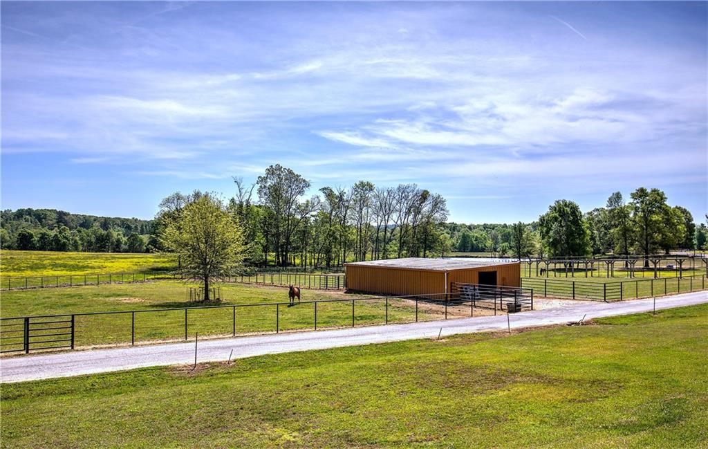 486 County Line Road Resaca, GA 30735 - Photo 10 of 49 a view of a swimming pool with a garden and lake view