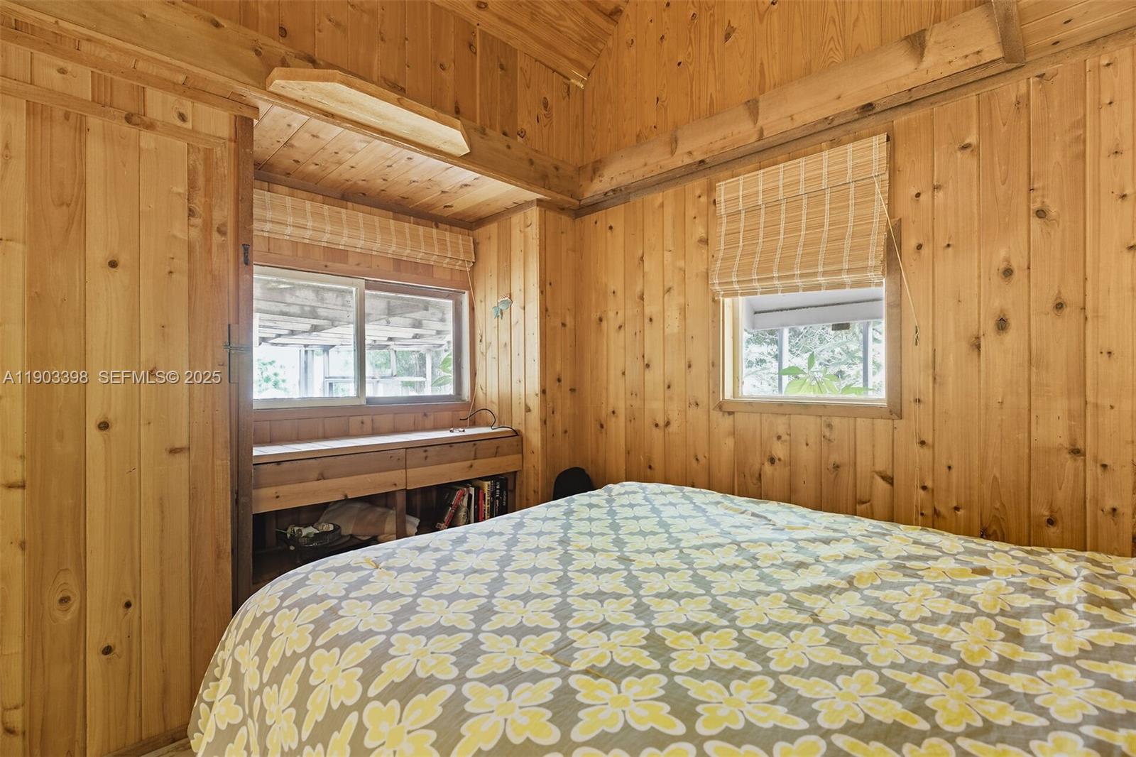 103 Tree Lane Tavernier, FL 33070 - Photo 13 of 33 a bedroom with a bed and a window