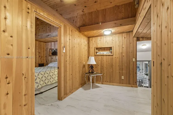 a dining room with furniture and a window
