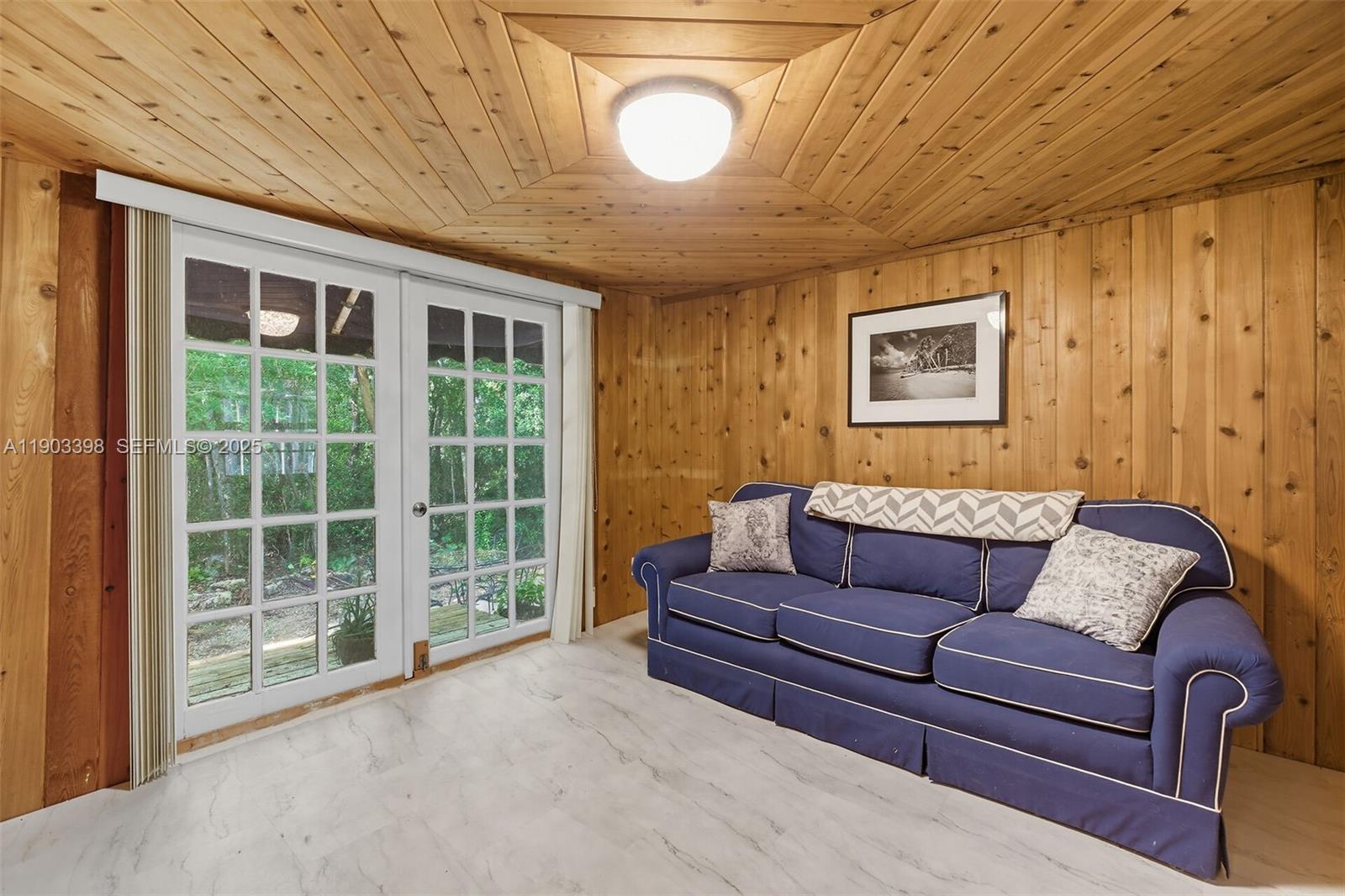 103 Tree Lane Tavernier, FL 33070 - Photo 18 of 33 a living room with furniture and a large window