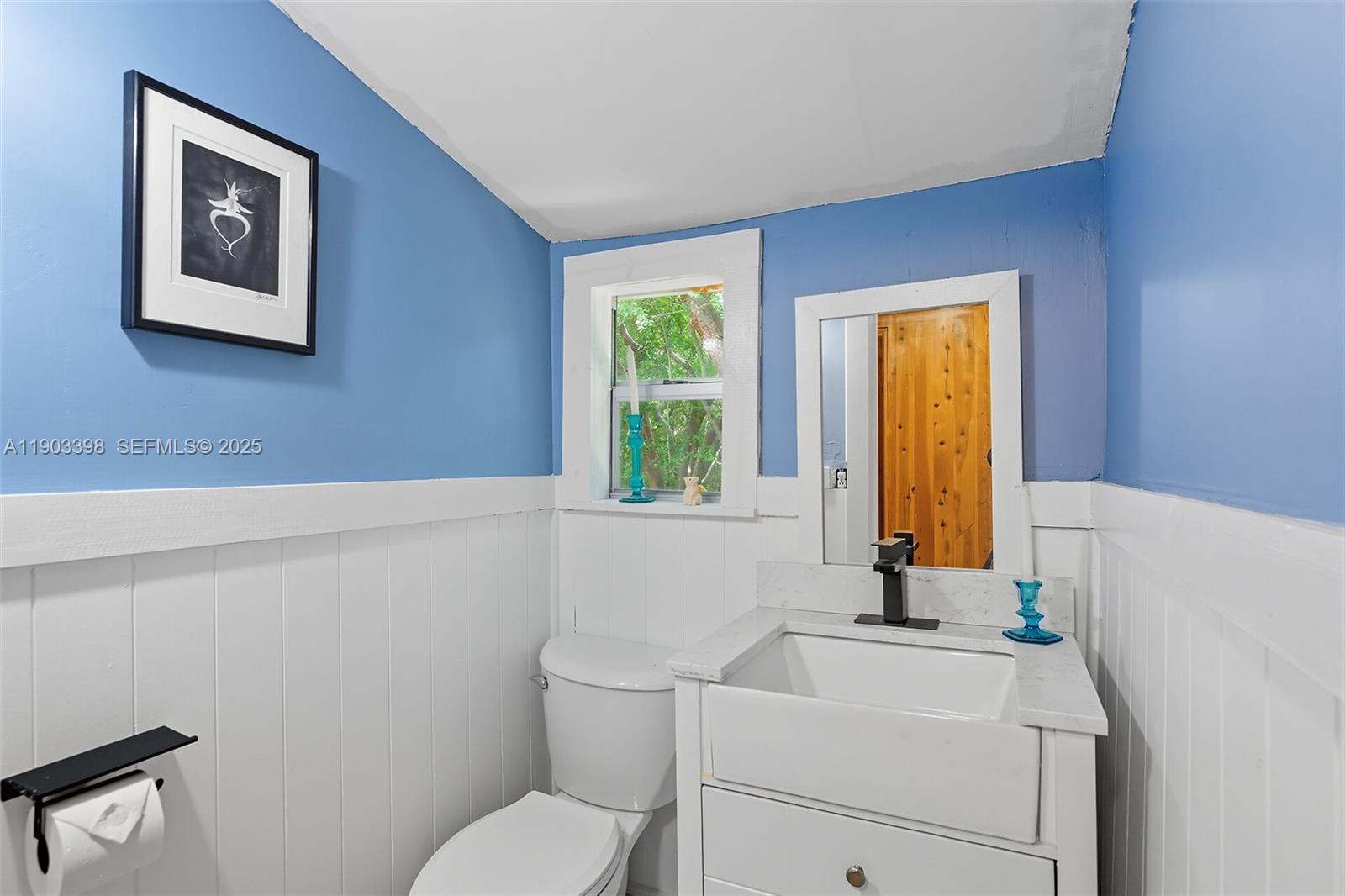 103 Tree Lane Tavernier, FL 33070 - Photo 19 of 33 a bathroom with a sink and a toilet