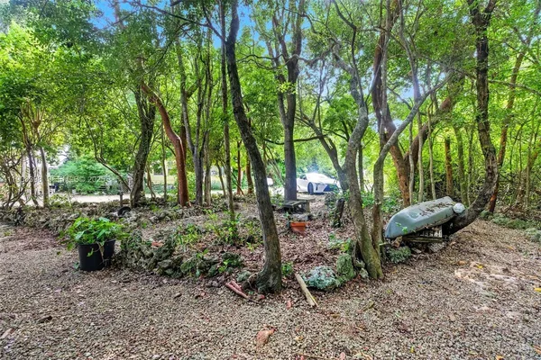a view of outdoor space with deck and trees