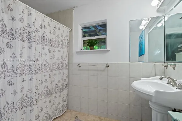 a bedroom with a bed and a chair