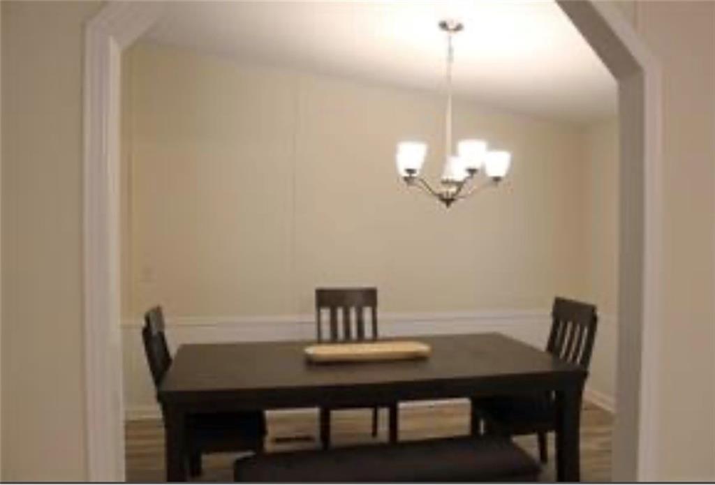 576 Nichols Road Pendergrass, GA 30567 - Photo 14 of 38 a view of a dining room with a table and chairs