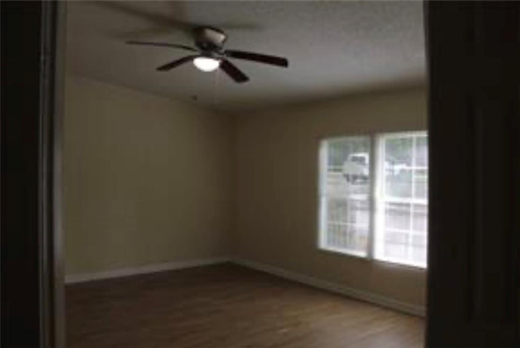 576 Nichols Road Pendergrass, GA 30567 - Photo 17 of 38 an empty room with windows and fan