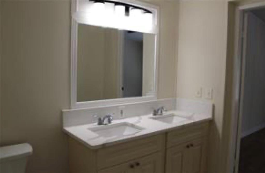 576 Nichols Road Pendergrass, GA 30567 - Photo 18 of 38 a bathroom with a sink and a mirror