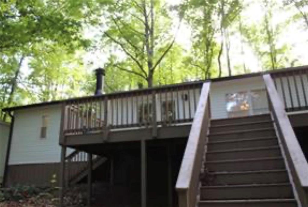 576 Nichols Road Pendergrass, GA 30567 - Photo 36 of 38 a view of balcony with wooden floor and outdoor seating