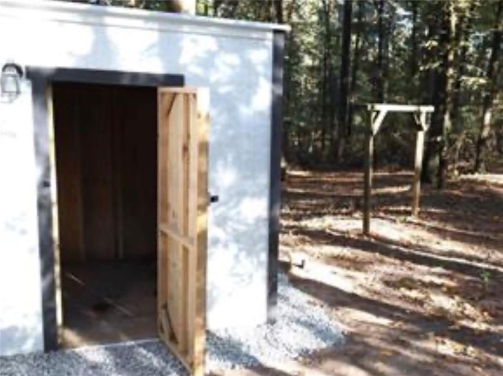 576 Nichols Road Pendergrass, GA 30567 - Photo 4 of 38 a view of backyard from door