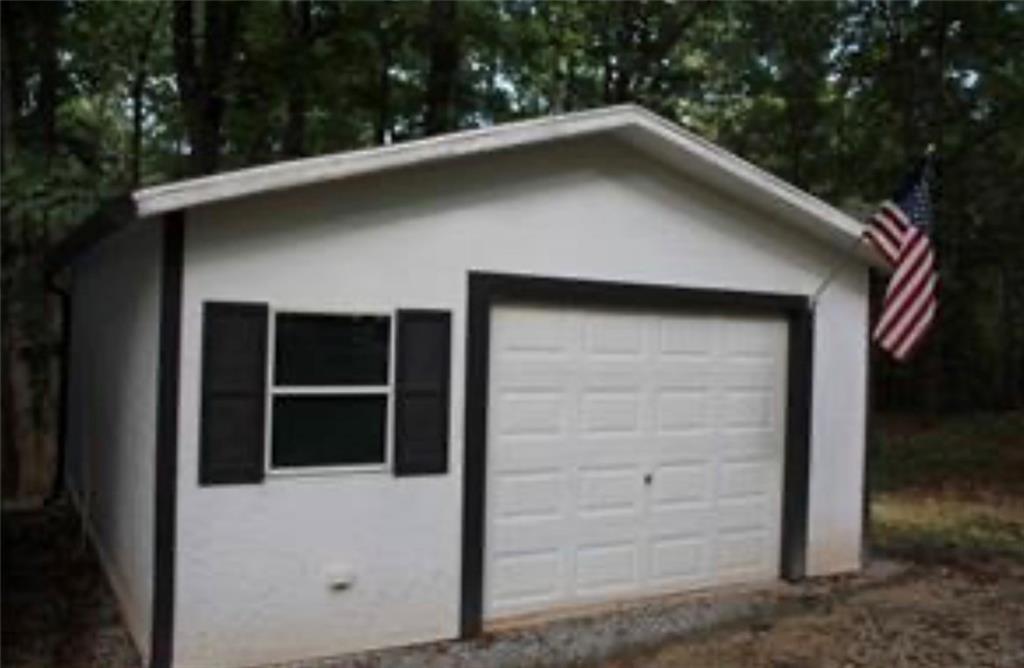 576 Nichols Road Pendergrass, GA 30567 - Photo 5 of 38 a house with a outdoor space