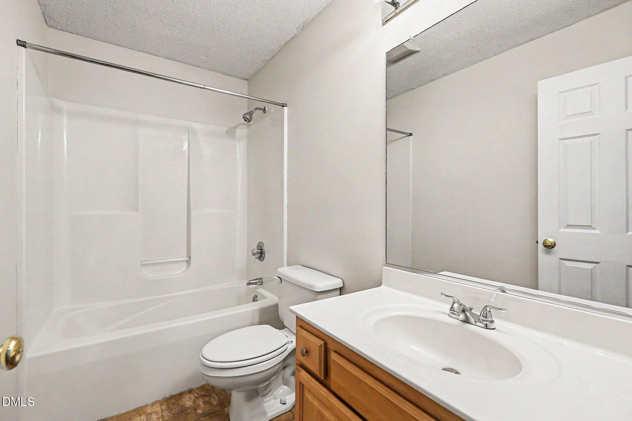 5359 Bass Mountain Road Snow Camp, NC 27349 - Photo 13 of 25 a bathroom with a sink toilet and shower