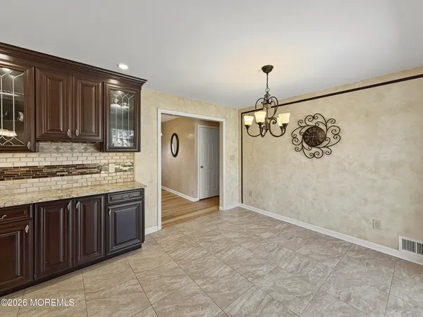 a view of a kitchen with a sink and cabinets