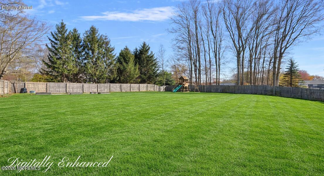 481 Tennent Road Morganville, NJ 07751 - Photo 38 of 43 Digitally EnhancedBackyard playset on a