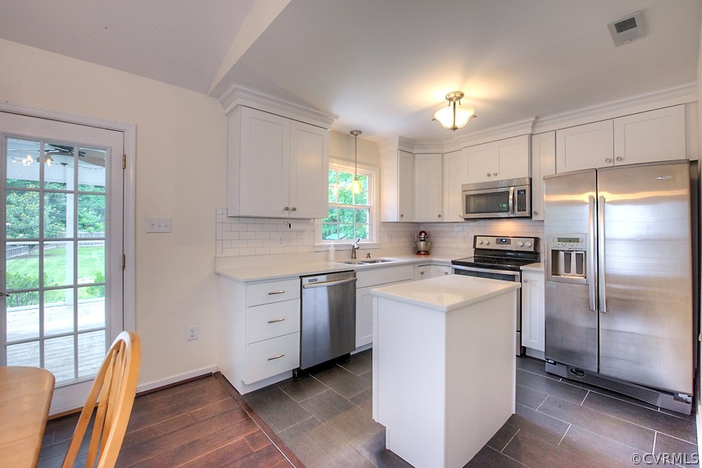 2533 London Road Henrico, VA 23233 - Photo 19 of 35 a kitchen with white cabinets and stainless steel appliances