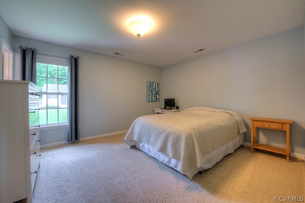 2533 London Road Henrico, VA 23233 - Photo 23 of 35 a spacious bedroom with a bed and a window