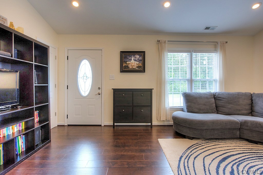 2533 London Road Henrico, VA 23233 - Photo 7 of 35 a living room with a couch a fireplace and a flat screen tv