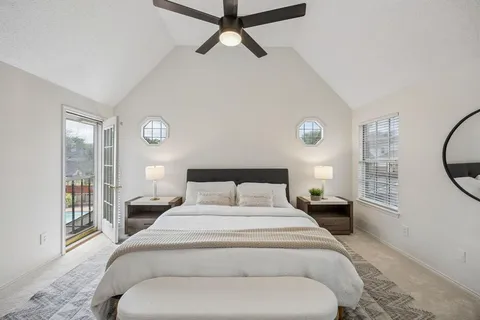 a bedroom with a large bed and a window