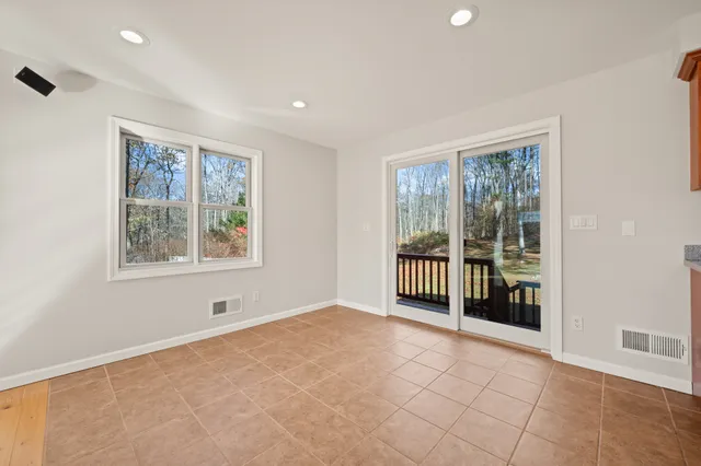 a kitchen with stainless steel appliances granite countertop a stove sink and microwave